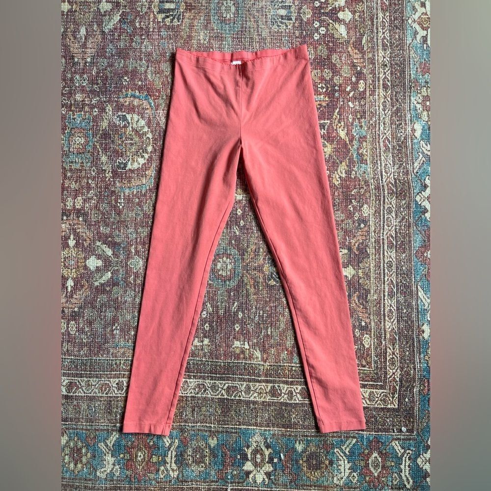 Girls size 16 Tea Collection leggings in coral pink ruffle like detail waist